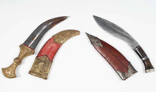 TWO EASTERN ASIAN KNIVES: TWO EASTERN ASIAN KNIVES: 1) Kukri, age and origin unknown, blade measures 7" in length, wood and metal handle, leather sheath, 11.375" in length overall; 2) Jambiya, blade measures 6.5" in length, 12