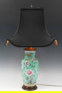 CHINESE FAMILLE ROSE PORCELAIN 2- LIGHT LAMP: CHINESE FAMILLE ROSE PORCELAIN LAMP: Aqua blue ground Famille Rose Porcelain Baluster form 2- light lamp, having an enameled Blossoming Peony motif with Butterflies and a Scholar's Rock. Black cloth s