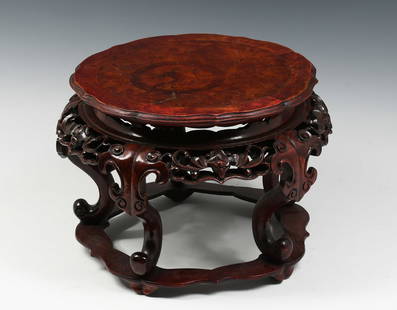 CARVED CHINESE BURLED ROSEWOOD PLANT STAND: CARVED CHINESE BURLED ROSEWOOD PLANT STAND: A 19th-century Carved Chinese Rosewood Jardiniere with a Burl wood inset top. Pierced stylized Bat & Cloud motif apron. Raised on scrolled legs. Approx. 8.1
