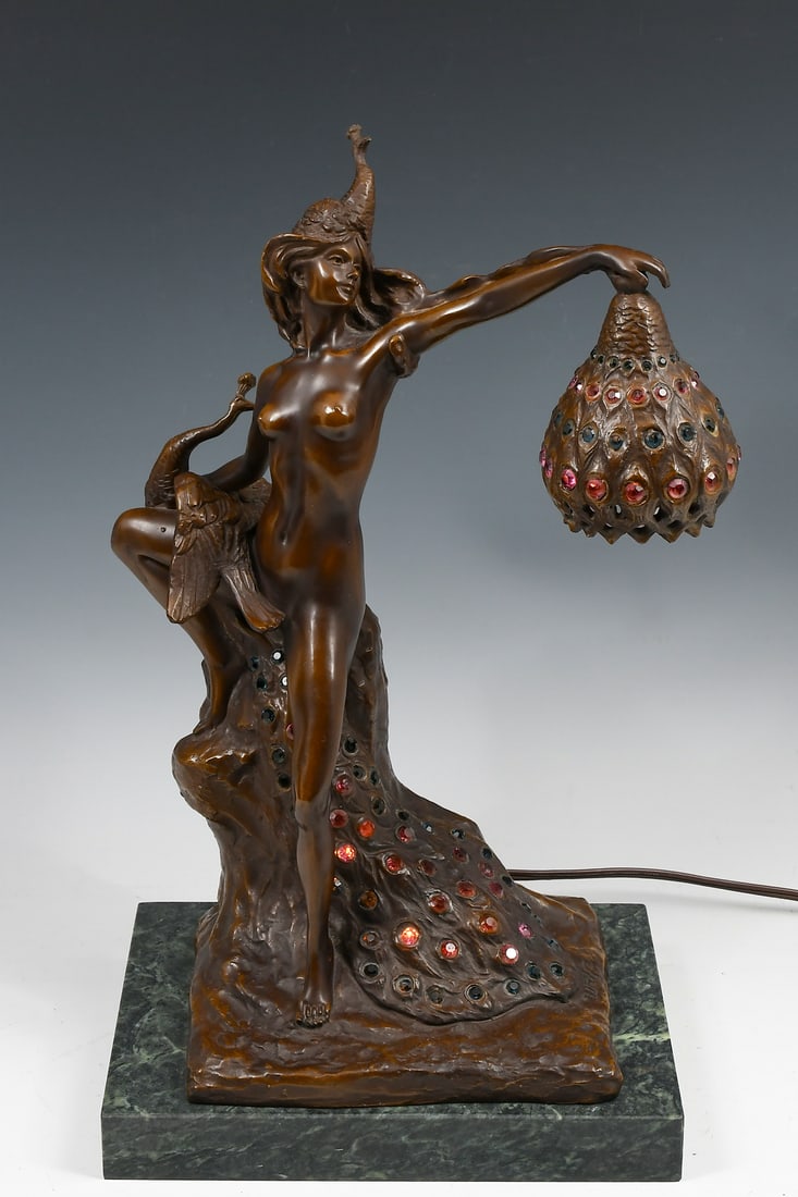 BRONZE NUDE AND PEACOCK LAMP AFTER WOLFERS: BRONZE NUDE AND PEACOCK LAMP AFTER WOLFERS: A cast bronze nude female figure on rocky base holding a peacock with flowing jeweled tail, the figure holds a shade aloft, signed "Wolfers" in casting, aft