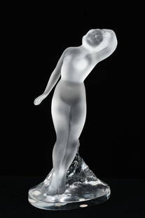 LALIQUE CRYSTAL DANSEUSE BRAS BAISSE NUDE FIGURE: LALIQUE CRYSTAL DANSEUSE BRAS BAISSE NUDE FIGURE: Frosted figure of a nude woman on clear base. Engraved signature at side of base. Approx. 9.25" h x 4.25" w x 3.75" d.