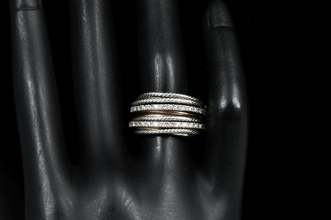 DAVID YURMAN DIAMOND CROSSOVER RING: DAVID YURMAN DIAMOND CROSSOVER RING: This sterling and diamond crossover ring by David Yurman uses a dynamic range of smooth and cable strands that explores the rhythmic weaving of line to create form