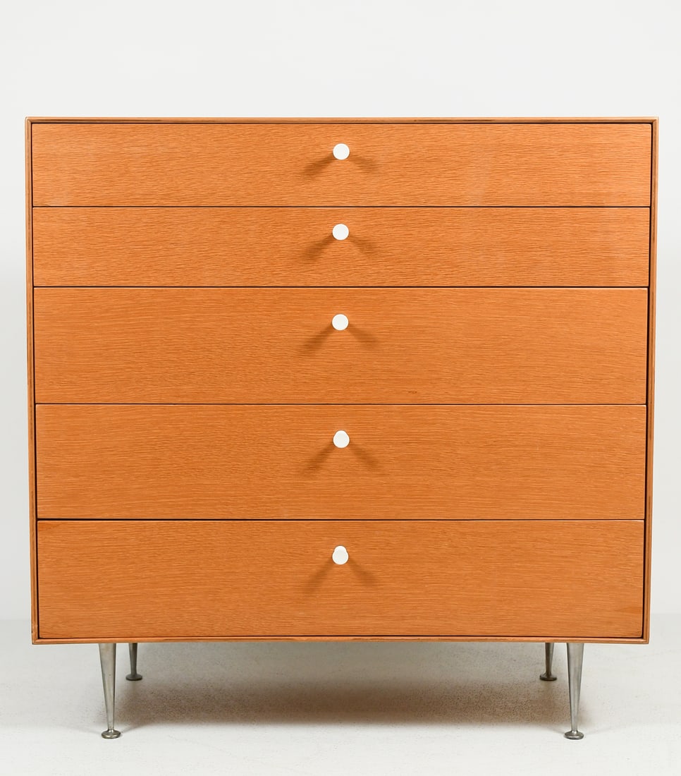 GEORGE NELSON FOR HERMAN MILLER DRESSER: GEORGE NELSON FOR HERMAN MILLER THIN EDGE DRESSER: A rare Mid-century Modern 5- Drawer Oak thin edge dresser. A Compartmented drawer over 4- graduated drawers with white plastic pulls. Raised on Alumi