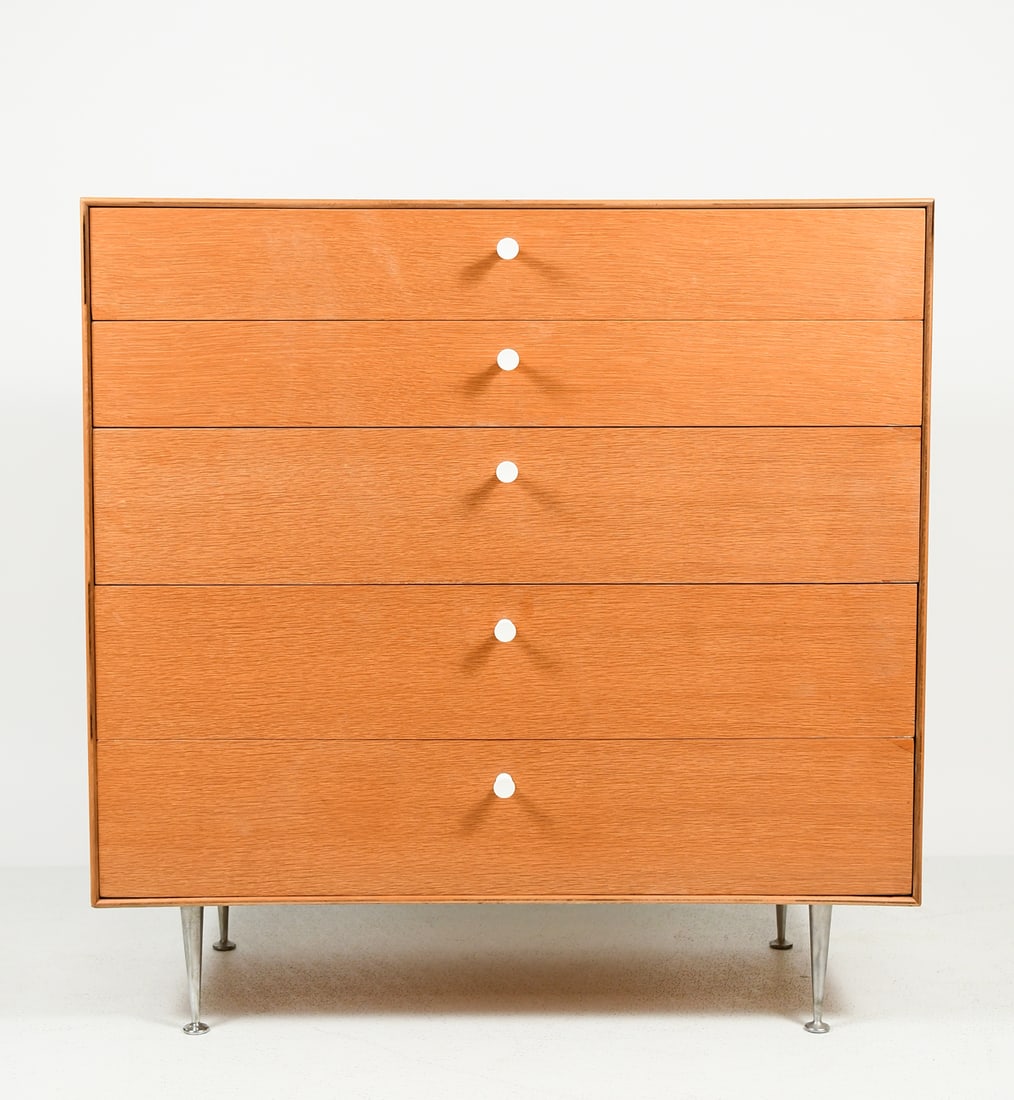 GEORGE NELSON FOR HERMAN MILLER DRESSER: GEORGE NELSON FOR HERMAN MILLER THIN EDGE DRESSER: A rare Mid-century Modern 5- Drawer Oak thin edge dresser. A Compartmented drawer over 4- graduated drawers with white plastic pulls. Metal tag resid