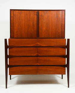 WILLIAM HINN TEAK DRESSER TAMBOUR DOORS: DANISH JORGEN CLAUSEN TEAK CHEST ON CHEST: Jorgen Clausen for Brande Mobelfabrik Teak Gentleman's Chest with a Tambour door top resting upon an 8- drawer chest. Raised on tapered feet. Approx. 54.5" h