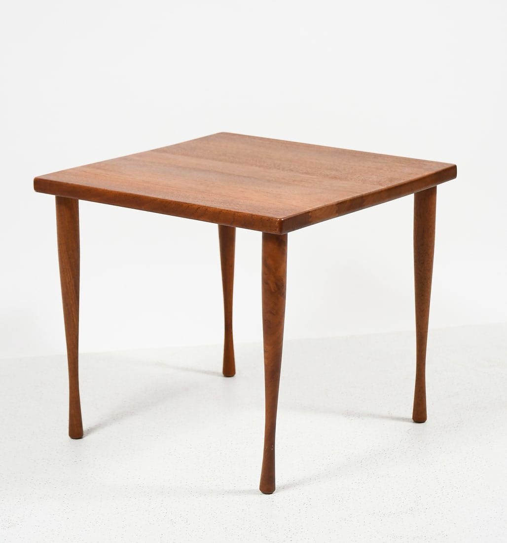 DANISH MODERN HANS ANDERSON TEAK SIDE TABLE: DANISH MODERN HANS ANDERSON TEAK SIDE TABLE: A Danish Teak Side Table by Hans Christian Andersen, raised on turned legs. Wood burned stamp at the underside. Approx. 16" h x 17.5" w x 17.75" d.