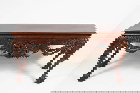 INDONESIAN CARVED SOFA / HALL TABLE: INDONESIAN CARVED SOFA / HALL TABLE: Carved Indonesian hall table, having a carved geometric apron with Draped Foliate & Floral strands with a semi-nude male figure in center. Raised on Cabriole legs