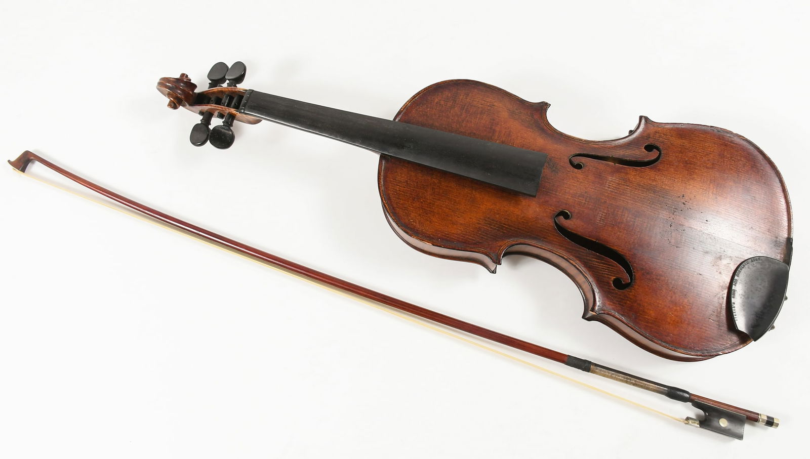 LAURENTIUS GUADAGNINI VIOLIN WITH A BAUSCH BOW: LAURENTIUS GUADAGNINI VIOLIN WITH A BAUSCH BOW: Wooden violin in velvet-lined case with bow. Violin measures 24" in length. Case measures 31" in length.