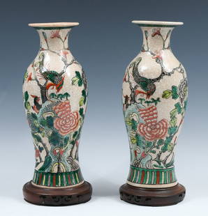 PR. OF CHINESE ENAMELED VASES WITH WOOD BASES: PR. OF CHINESE ENAMELED VASES WITH WOOD BASES: Pair of Circa 1960's Imported Chinese Crackle glazed Porcelain vases, having an enameled Bird perched amongst blossoming foliate motif. Also included are