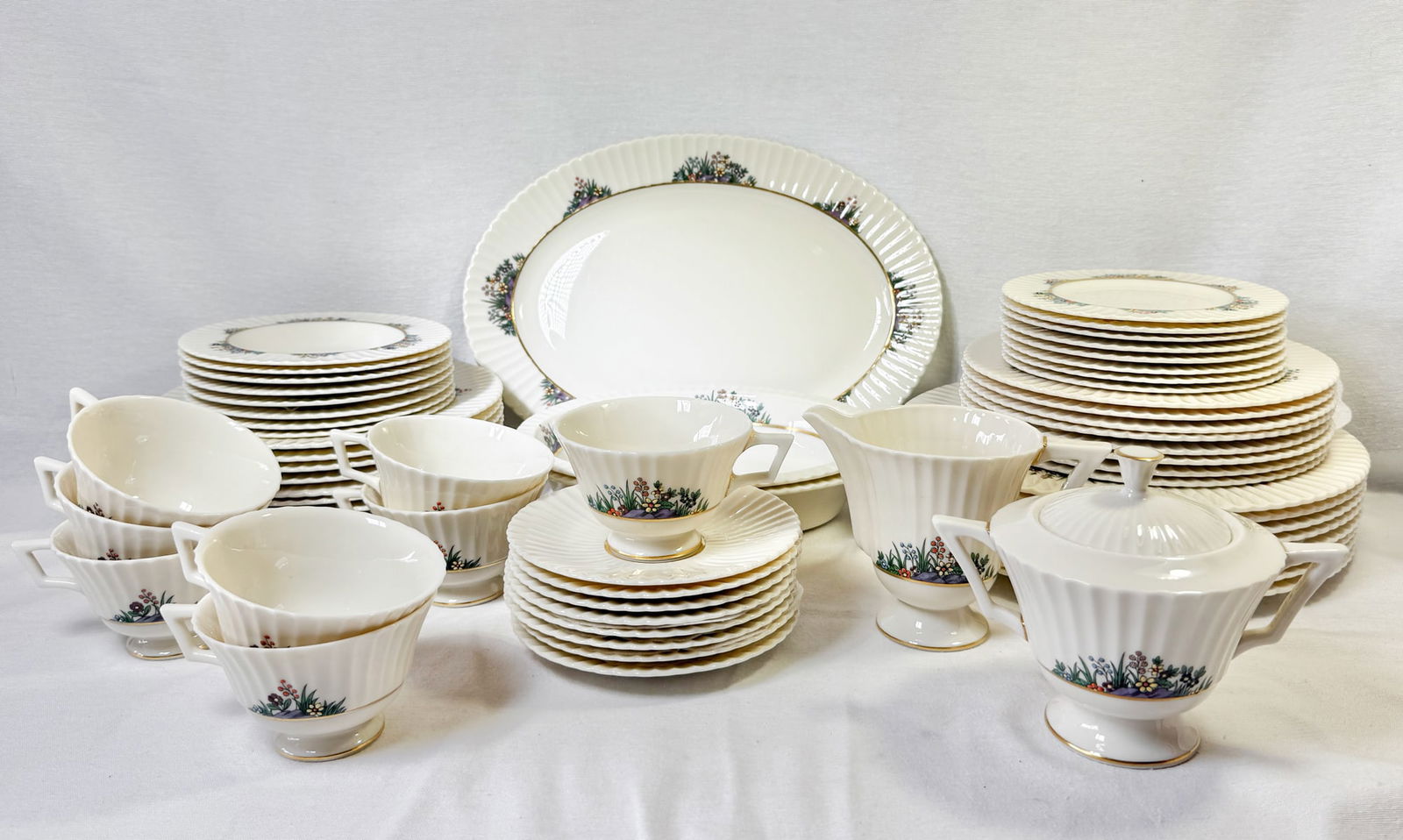 61 PC. LENOX "RUTLEDGE" DINNERWARE SET: 61 PC. LENOX "RUTLEDGE" DINNERWARE SET: Comprising: 8- Dinner Plates, 8- Luncheon Plates, 8- Bread Plates, 8- Soup Bowls, 8- Dessert Bowls, 8- Tea cups, 8- Saucers, 2- Open Vegetable Serving Bowls, 1-