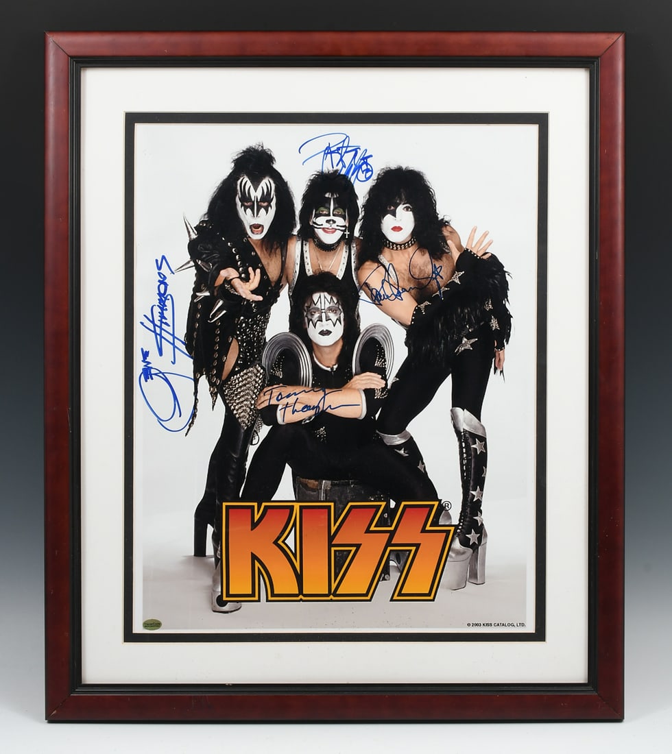 AUTOGRAPHED KISS PHOTO: AUTOGRAPHED KISS PHOTO: 20" x 16" group photo of the iconic rock band's post-2000 lineup - Gene Simmons, Ace Frehley, Paul Stanley, and Tommy Trayer - signed by all four. Certificate of Authenticity v
