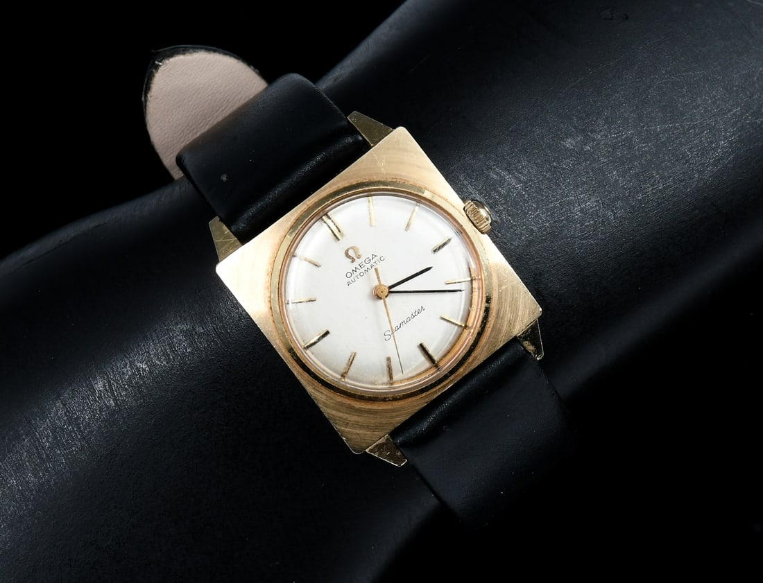 14K OMEGA WATCH LADIES: 14K OMEGA WATCH LADIES: Ladies 14K yellow gold Omega wristwatch with luxurious brown leather band. Square in shape, Inscription on the back side. late mcm.