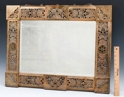 FRENCH ART NOUVEAU PIERCED BRASS MIRROR: FRENCH ART NOUVEAU PIERCED BRASS MIRROR: Designed by Hublot Bocnard for De Shield's Brass Mirror, having a pierced Floral motif with Wagon wheel medallions. Attached chain for hanging. Signed at the v