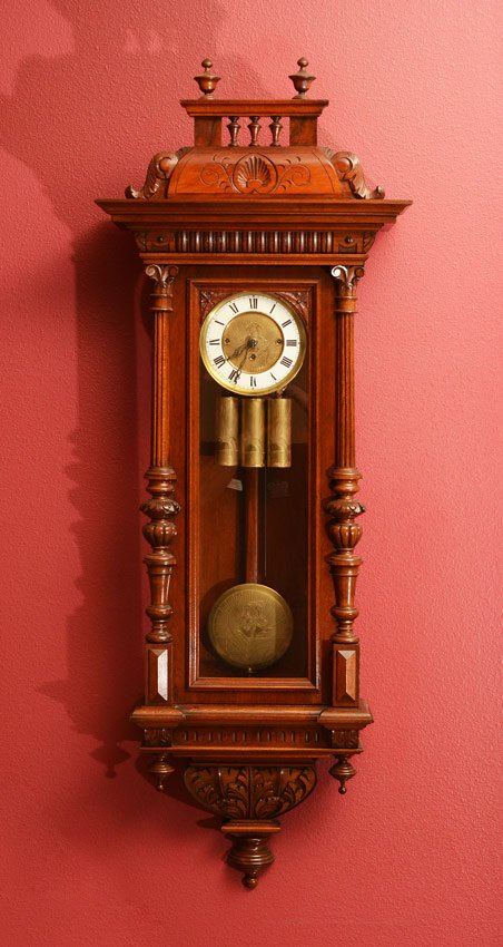 GUSTAV BECKER TRIPLE WEIGHT REGULATOR WALL CLOCK: GUSTAV BECKER TRIPLE WEIGHT REGULATOR WALL CLOCK: Carved removable crest with 3 finials, carved pediment, door with applied fluted half columns, 3 lower finials. Dial with engraved center, porcelain r