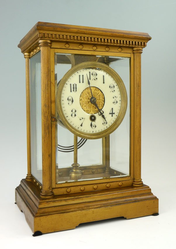 BOSTON CLOCK COMPANY TANDEM WIND CRYSTAL REGULATOR: BOSTON CLOCK COMPANY TANDEM WIND CRYSTAL REGULATOR CLOCK: Brass case with dentil molding, columns at corners, beveled glass panels. Enamel dial with Arabic numerals, filigree central medallion. Engrav