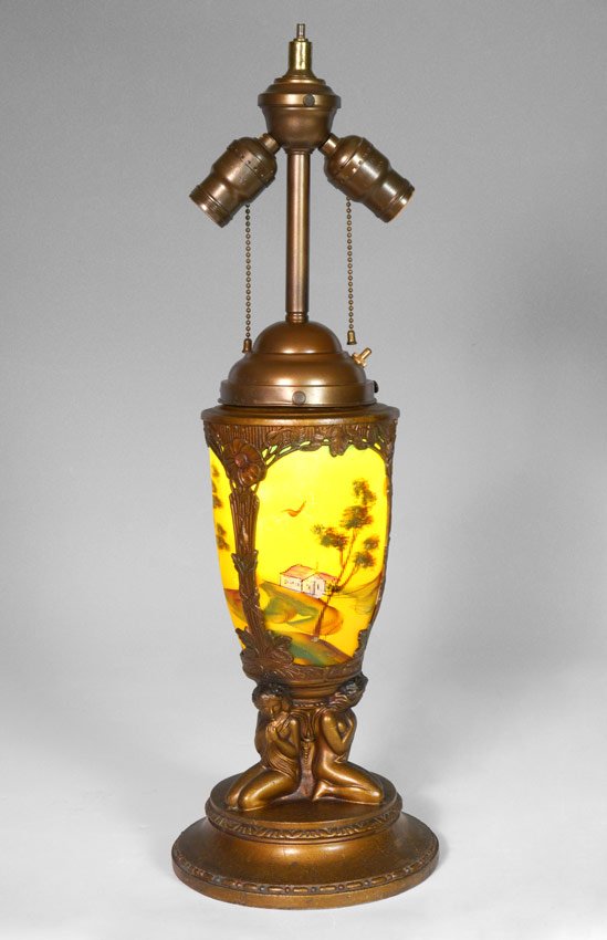 RIBBED REVERSE PAINTED GLASS LAMP BASE: RIBBED REVERSE PAINTED GLASS LAMP BASE: Patinated cast metal base featuring 3 maidens, ribbed glass body with 3 panel reverse painted panels, framed with floral motifs. 2 light fixture. 23'' h. x 7 1/