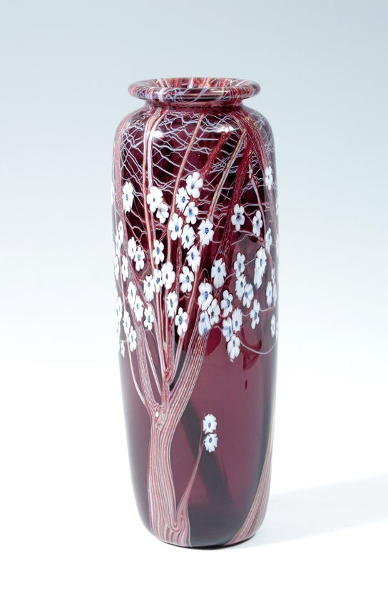 ORIENT & FLUME HAWTHORNE ART GLASS VASE: ORIENT & FLUME HAWTHORNE ART GLASS VASE: Featuring 3 trees with white millefiori flowers on amethyst glass vase. Engraved Orient & Flume 1982 M 85 on base. Measures 11 1/8'' h. x 4''.