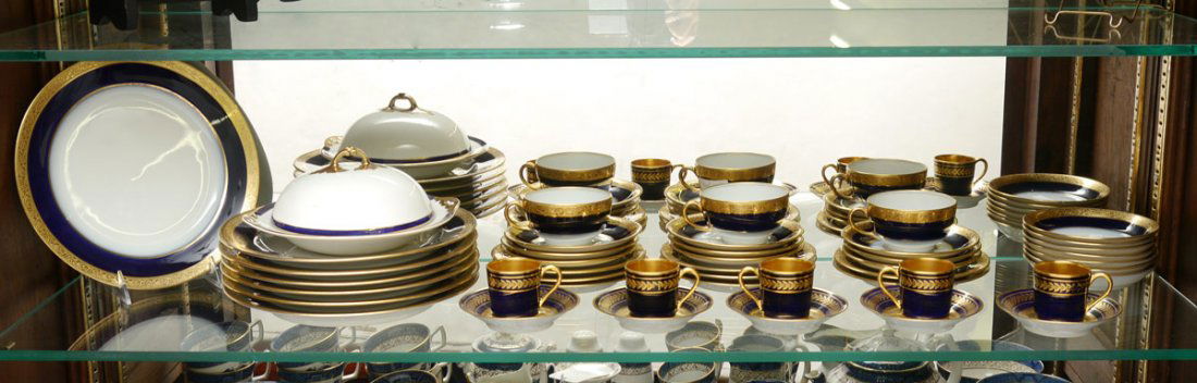 COBALT & GOLD FRENCH LIMOGES CHINA: FRENCH LIMOGES FINE CHINA: Cobalt and gold rim. 44 piece total to include by Jean Pouyat: 7 dinner plates (9 1/2"), 8 bread plates, 3 cups, 9 saucers, and 7 dessert bowls. Sold with Bernardaud & Co. 5