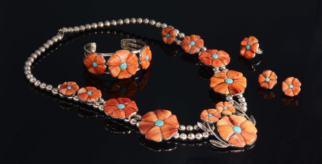 STERLING & SPINY OYSTER SQUASH BLOSSOM ENSUITE: STERLING & SPINY OYSTER SQUASH BLOSSOM JEWELRY ENSUITE: Marked Sterling and signed B.Y. to include 21" beaded sterling necklace with eight graduated carved coral rosettes and a central triple rosette 