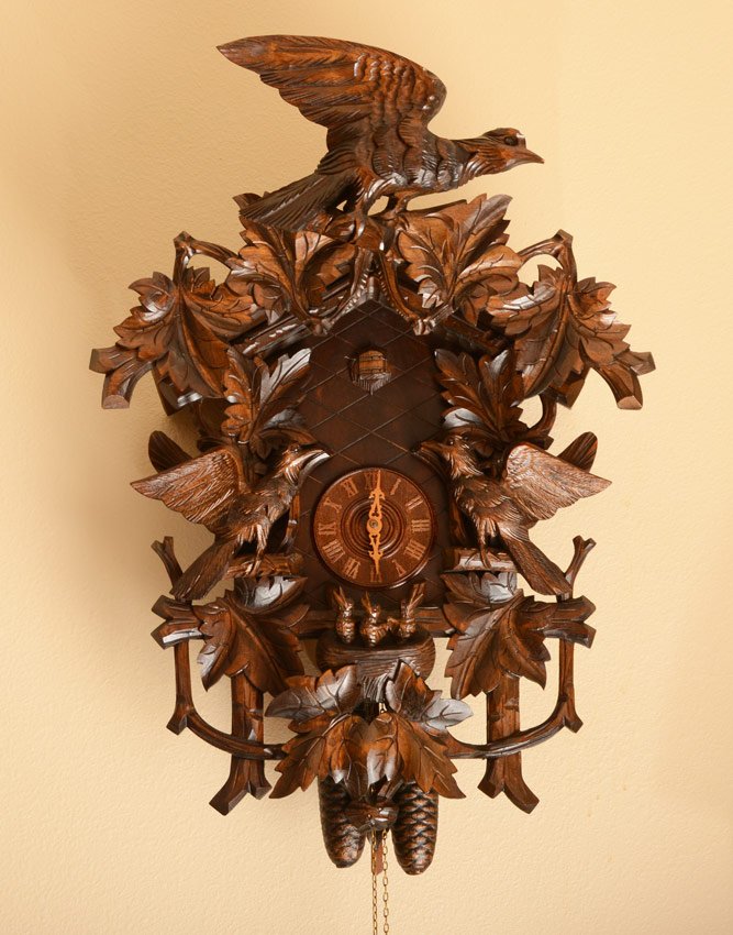GAME ENHANCED BLACK FOREST CUCKOO CLOCK: GAME ENHANCED BLACK FOREST CUCKOO CLOCK: 20th century, removable crest with bird and oak leaves. Case with 3 applied birds, leaves and nest with 3 chicks. Approx. 26'' h. x 19'' x 9 3/4''.
