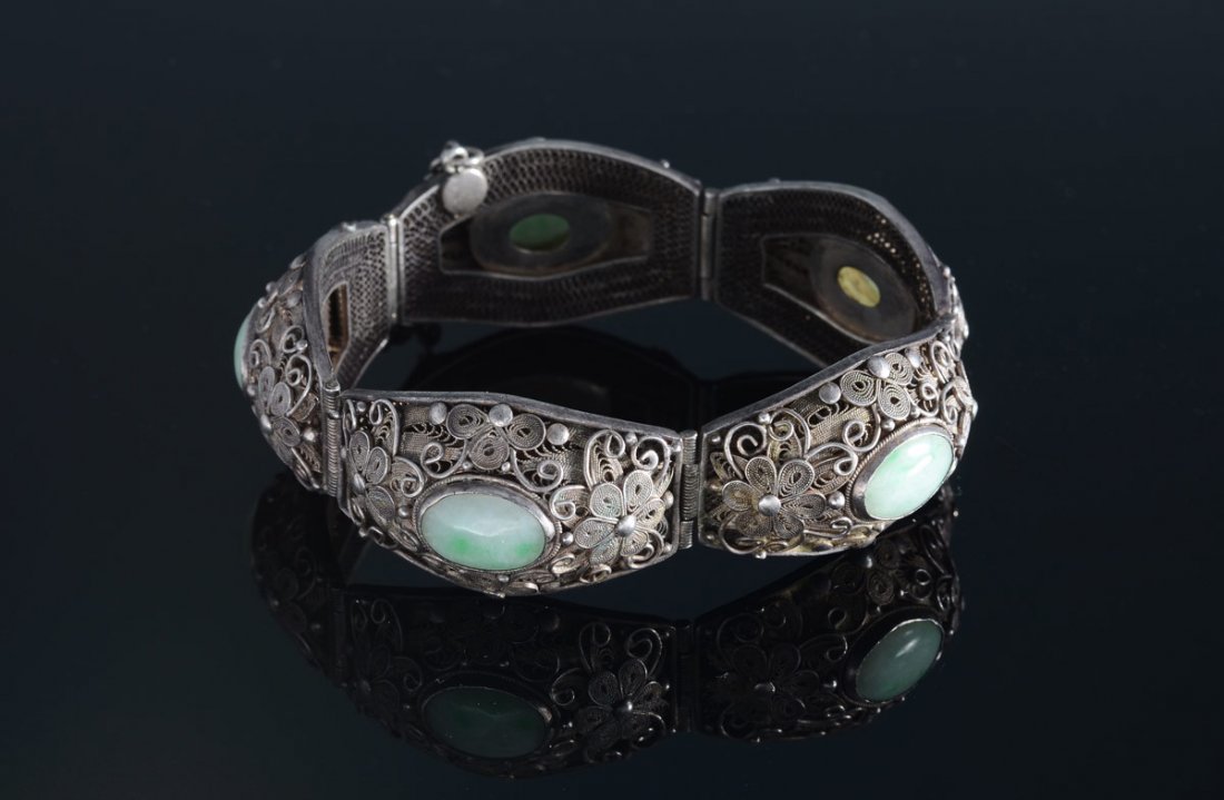 SILVER & JADE ETRUSCAN BRACELET: SILVER & JADE ETRUSCAN BRACELET: 5 cabochon cut pieces of jadeite jade, 12 x 13 mm. The silver content is unknown. Safety chain and clasp. Length: 6".