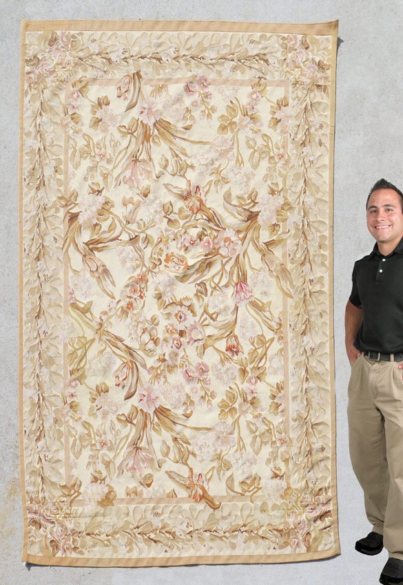 MODERN CHINESE NEEDLEPOINT WOOL RUG 5'7" x 9': MODERN CHINESE NEEDLEPOINT WOOL RUG, 5' 7" x 9' 1": This handmade flat weave rug has a French Aubusson design and style that consists of an overall pattern of pale colored flowers and leaves on an ivo