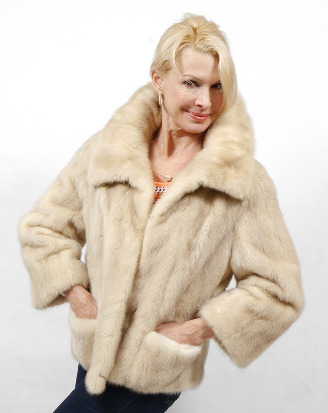 SASSY BLOND MINK FUR JACKET: A SASSY LITTLE MINK JACKET: Blonde fur jacket with wide collar, bell sleeves and exterior pockets. Measures approx. 24" collar to hem and 17" shoulder to shoulder.