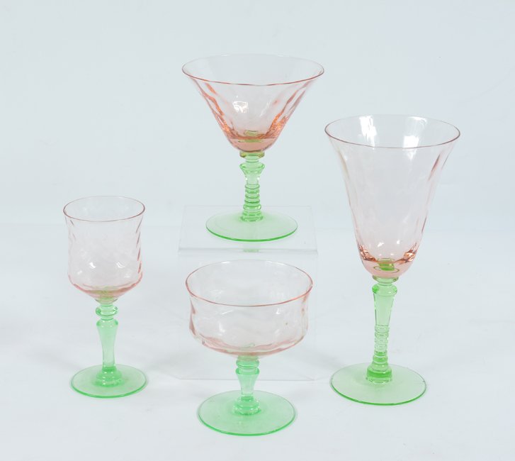 COLLECTION OF GLASS COCKTAIL STEMWARE: COLLECTION OF GLASS COCKTAIL STEMWARE: With pink tops and green stems, approx. 41 pieces to include 8 wine (7 3/4"), 7 martini (5"), 10 margarita (5 3/8"), 4 low margarita (4"), 12 cordial (5 3/8").