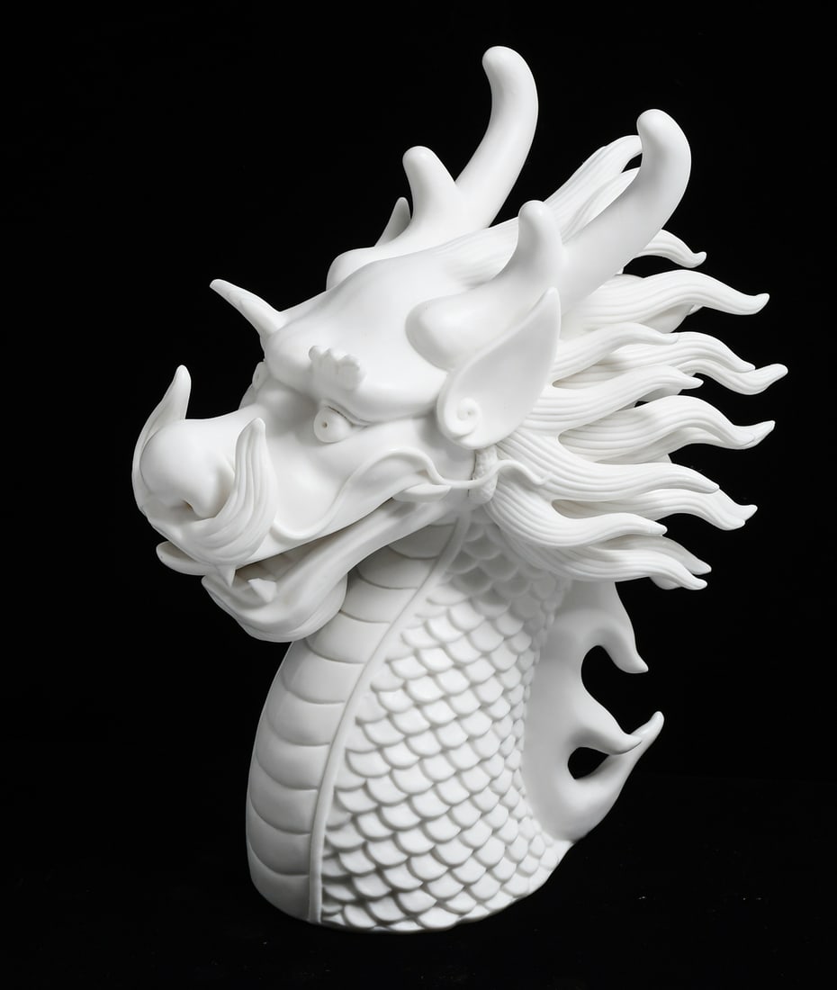 BISQUE PORCELAIN DRAGON HEAD SCULPTURE: BISQUE PORCELAIN DRAGON HEAD SCULPTURE: A Bisque Porcelain West Wind Dragon's head sculpture. Incised "N" at the underside. Approx. 9.125" h x 4.75" w x 7.5" d.