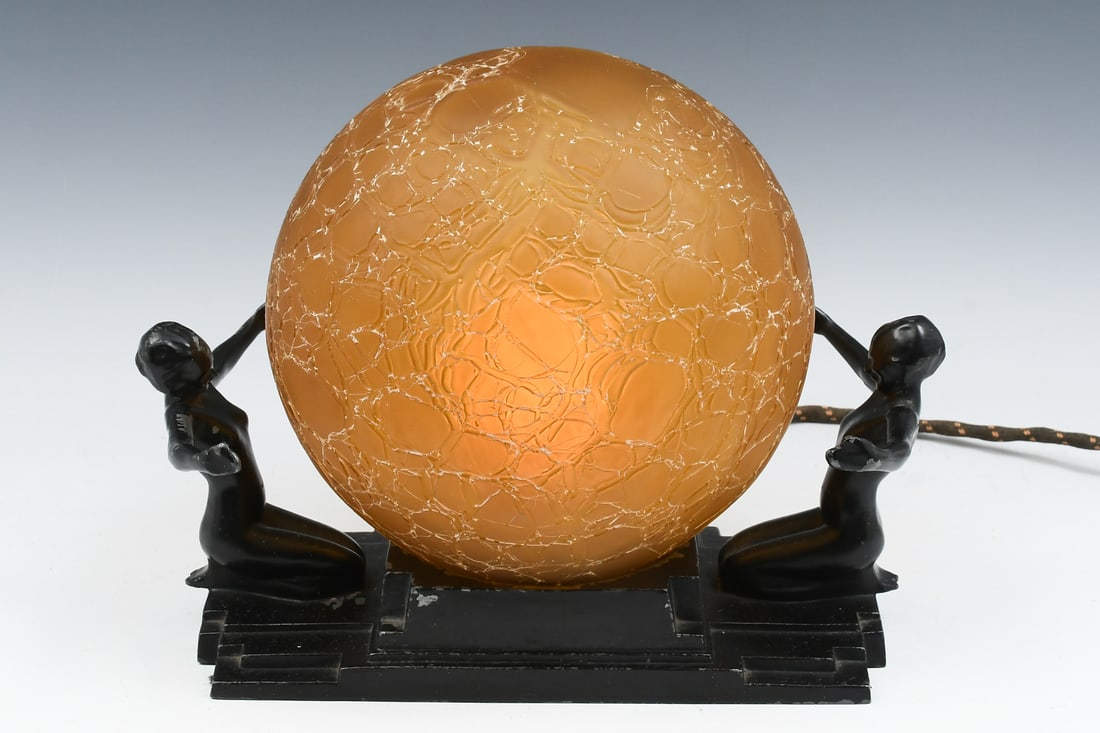 FRANKART DOUBLE FEMALE NUDE LAMP WITH BRAIN SHADE: FRANKART DOUBLE FEMALE NUDE LAMP WITH BRAIN SHADE: Art deco Frankart lamp having 2 kneeling nude women flanking an amber brain shade. Signed Frankart Inc. Approx. 8.75'' h x 11.875'' l x 8'' w.