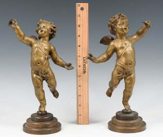 PAIR OF FESTIVE CHERUB BRONZES