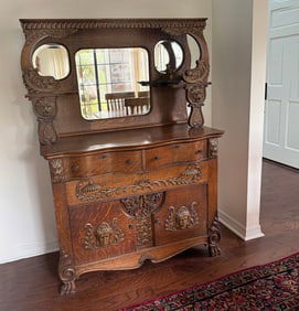 OAK SIDEBOARD W/ MYTHOLOGICAL RELIEF CARVINGS