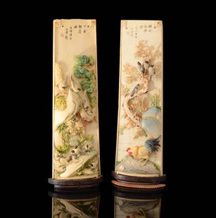 PAIR CHINESE POLYCHROME CARVED IVORY WRIST RESTS: PAIR CHINESE POLYCHROME CARVED IVORY WRIST RESTS: Each carved in high detail featuring birds, foliate and floral motifs. Each side with inscribed story or verses, mounted to wood stands with wire and