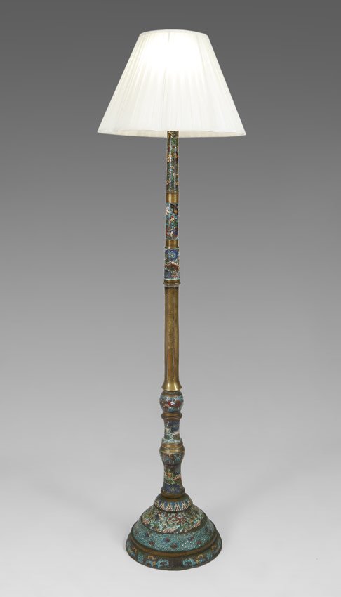 CHAMPLEVE FLOOR LAMP: CHAMPLEVE FLOOR LAMP: Brass body with floral cloisonne embellishments in rings around shaft and base. Double light fixture. Sold with cloth shade. Overall 67 1/2" h. x 13" dia., shade 12" x 19 1/4". A