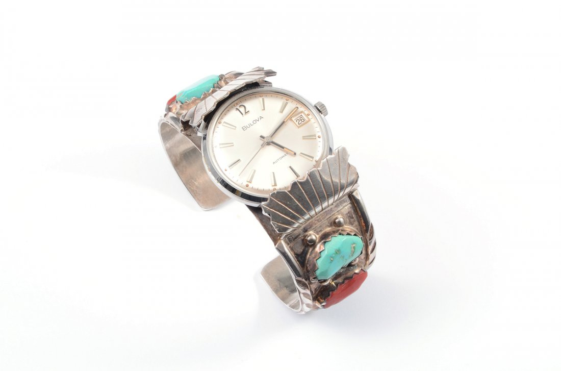 CHEAMA ZUNI CUFF WATCH BRACLET WORKING BULOVA: SIGNED ZUNI WATCH CUFF WITH BULOVA WATCH: Silver, turquoise and coral watch cuff signed A. Cheama (Angelita). The Bulova Automatic with bar markers on the dial and date window is in good running order