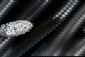 PLATINUM EDWARDIAN 1.68 CTW RING: PLATINUM EDWARDIAN 1.68 CTW DIAMOND RING: Platinum Edwardian revival ring contains one old European round cut diamond. WEIGHT: 1.18 Ct. Rated VS2 in clarity and I in color. 32 round brilliant cut diam