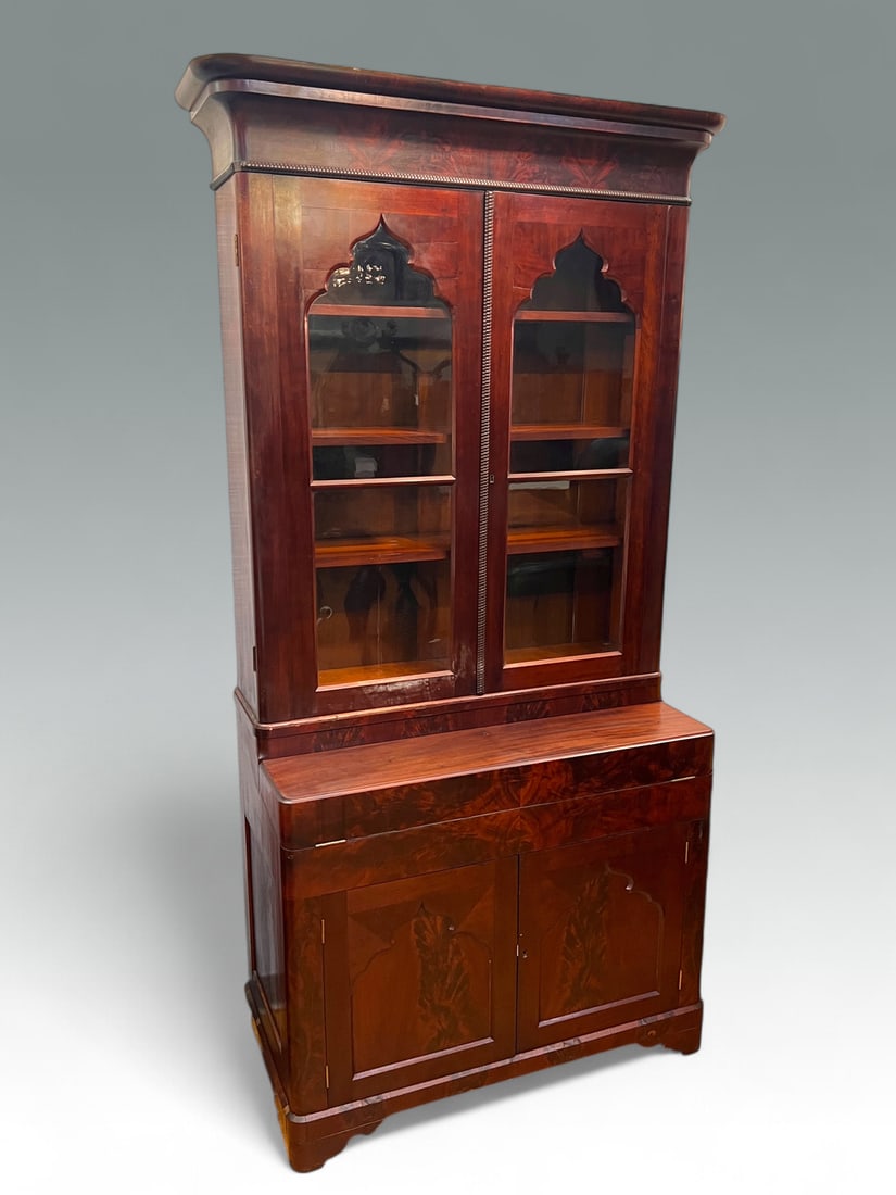19TH-CENTURY SECRETAIRE BOOKCASE: 19TH-CENTURY SECRETAIRE BOOKCASE: 2- Door Bookcase with Original shaped glass. Resting on a flip-top desk that opens to reveal a green felt writing surface with three drawers and compartments under wr