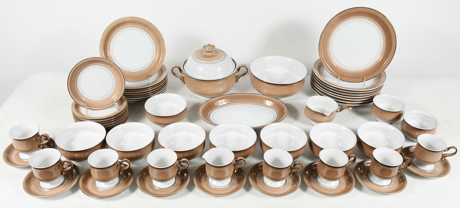 DENBY ENGLISH STONEWARE "SEVILLE" DINNERWARE: DENBY ENGLISH STONEWARE DINNERWARE IN THE SEVILLE PATTERN: 57 piece service for 8 to include 8 dinner plates (10.5"), 9 salad plates, 8 soup bowls, 8 bread plates, 8 footed cups and 9 saucers. Serving