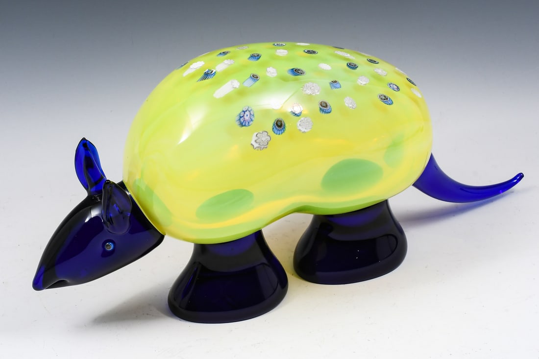 ARMADILLO GLASS SCULPTURE: ARMADILLO GLASS SCULPTURE: Quirky Blue and Yellow Art Glass Armadillo Sculpture, 8.5" in height, 18.5" in length, sticker affixed to the front foot reading "Formia - Vetri di Murano - Made in Italy".