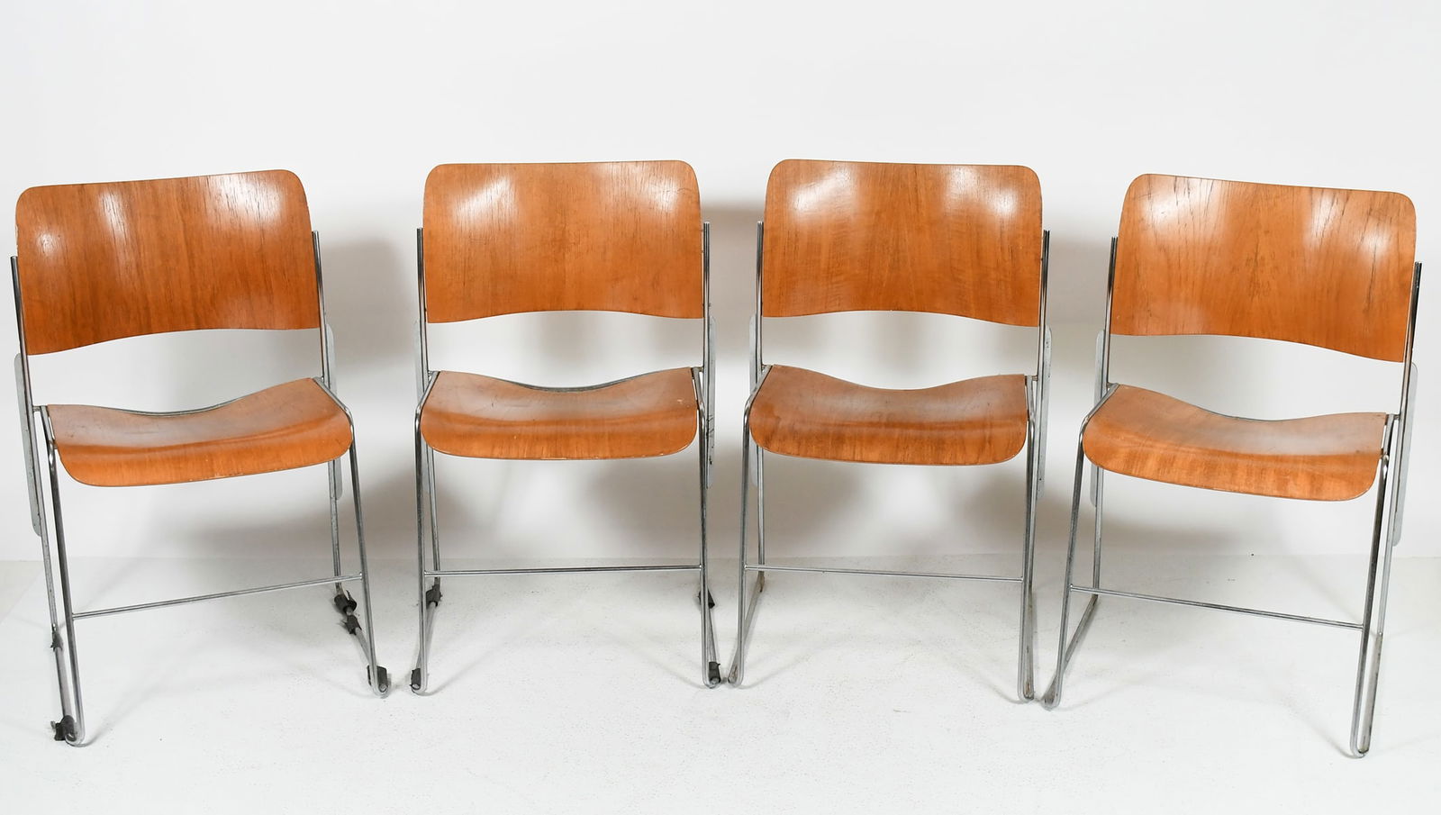 4 PC. MCM DAVID ROWLAND 40/4 STACKING CHAIRS: 4 PC. MCM DAVID ROWLAND 40/4 STACKING CHAIRS: 4 stacking 40/4 chairs designed by "David Rowland" for GF Business Furniture. Chairs have the original label on the bottom. Bent Plywood with on Chromed f