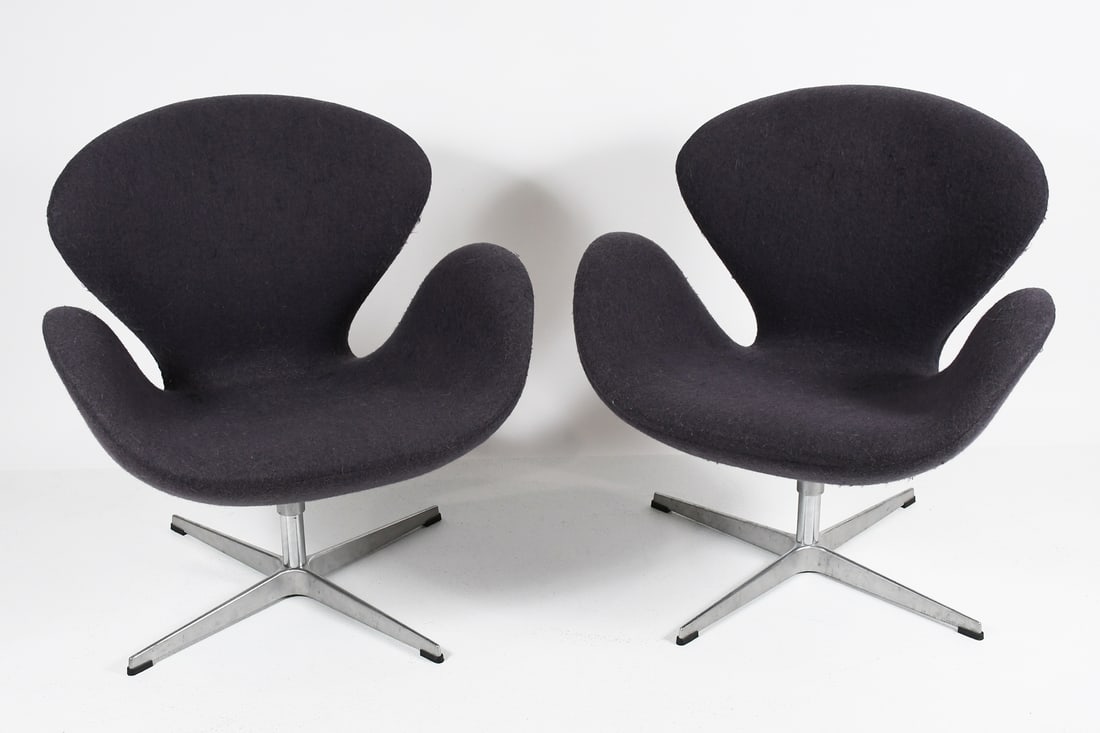 PR. ARNE JACOBSON SWAN CHAIRS: PR. ARNE JACOBSON SWAN CHAIRS: Pair of Grey Wool upholstered Arne Jacobson designed mid-century modern style Swan Chairs. Raised on a swiveling chromed base. Approx. 30.25" h x 29" w x 24.5" d.