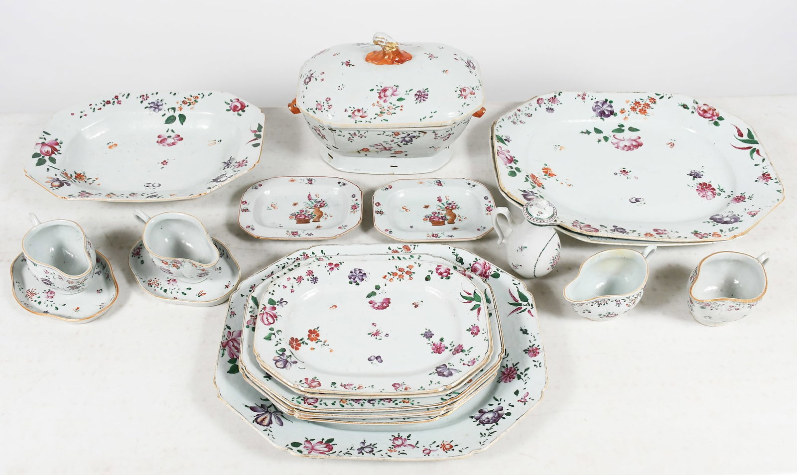 18TH-CENTURY CHINESE FAMILLE ROSE EXPORT PORCELAIN: 18TH-CENTURY CHINESE FAMILLE ROSE EXPORT PORCELAIN: Large collection of servingware, including octagonal serving dishes, creamers, smaller serving dishes, and a large covered dish. Largest piece measu