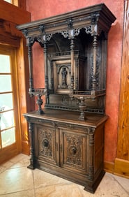 FIGURAL CARVED STEPBACK CUPBOARD