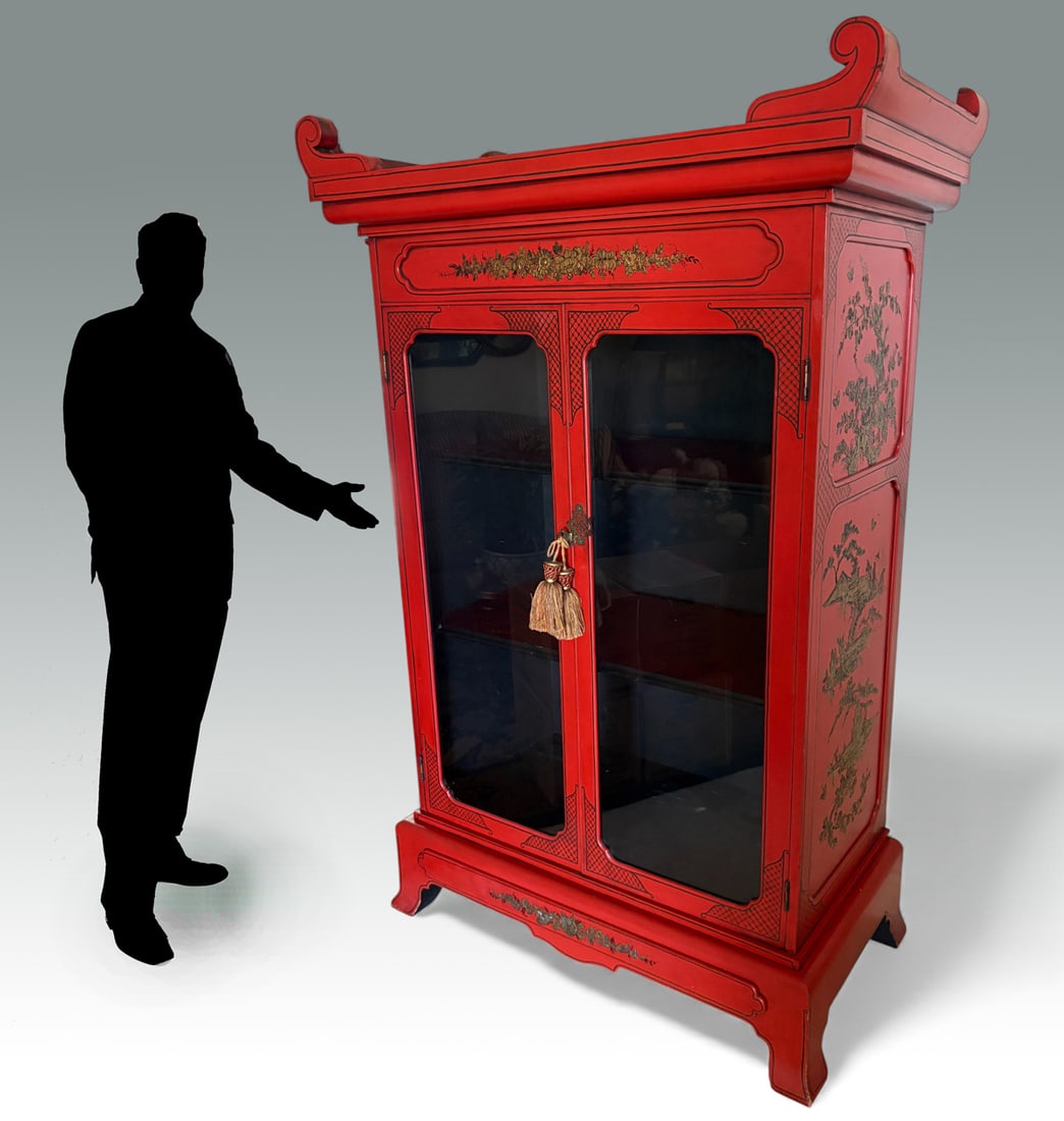 RED LACQUERED ASIAN CHINA/CURIO DISPLAY CABINET: RED LACQUERED ASIAN CHINA/CURIO DISPLAY CABINET: 2- Door red lacquered curio cabinet with Gold painted Chinoiserie scenes. Lighted interior with switches attached at the reverse. Single shallow drawer