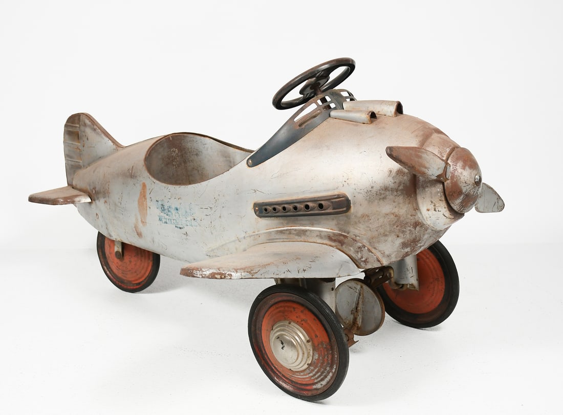 MURRAY STEELCRAFT PURSUIT PEDAL CAR AIRPLANE: MURRAY STEELCRAFT PURSUIT PEDAL CAR AIRPLANE: Circa 1941, Murray Steelcraft Pursuit pedal car in original untouched condition. Approx. 25" h x 46.5" l x 36" w.