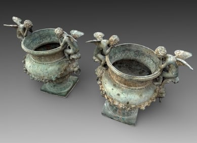 PAIR OF BRONZE CHERUBIC GARDEN JARDINIERES