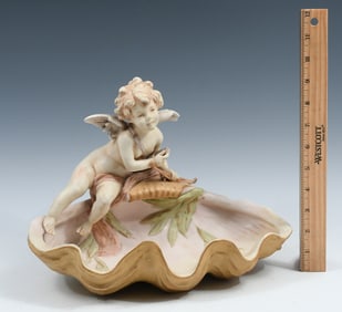 ROYAL DUX PORCELAIN CUPID ON AN CLAM SHELL