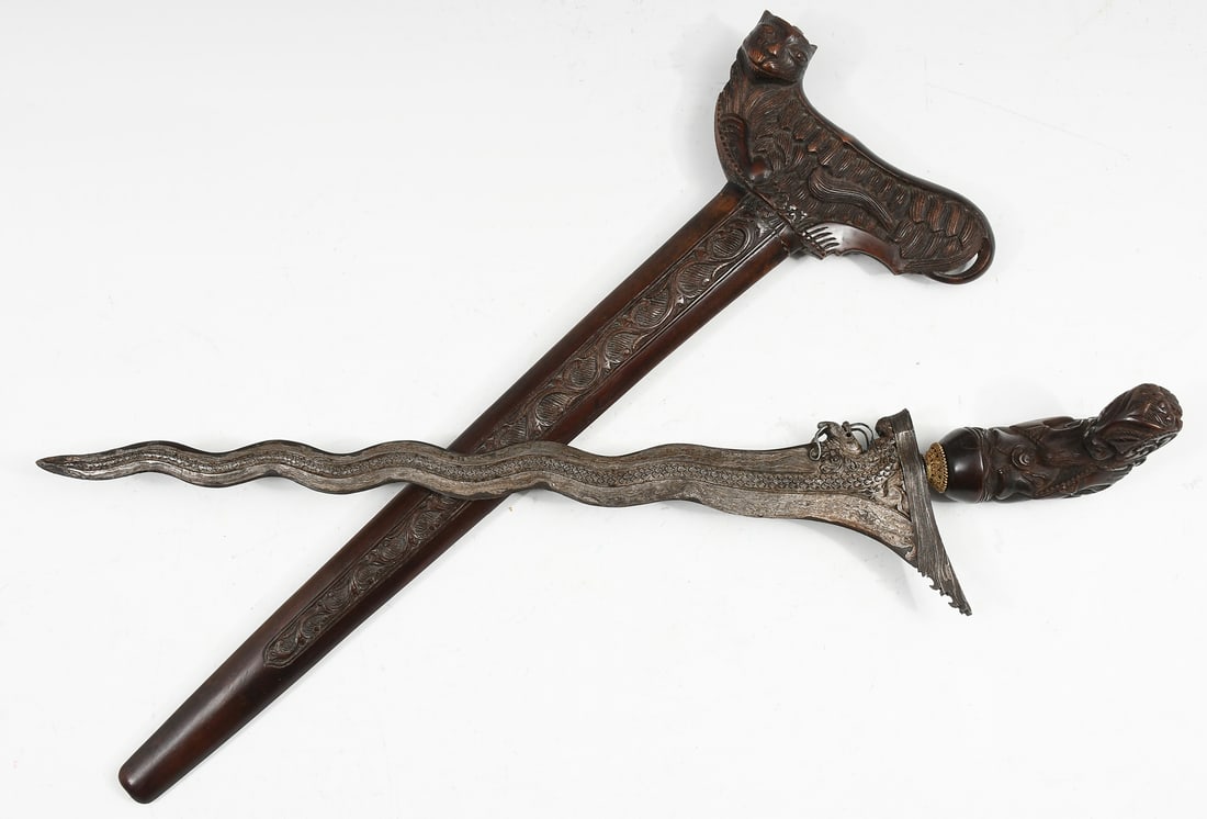 KERIS KNIFE WITH DAMASCUS BLADE & TIGER SCABBARD: KERIS KNIFE WITH DAMASCUS BLADE & TIGER SCABBARD: Wavy-blade keris ("kriss") knife of Damascus steel featuring intricate designs on the blade that give the appearance of a serpentine dragon running do
