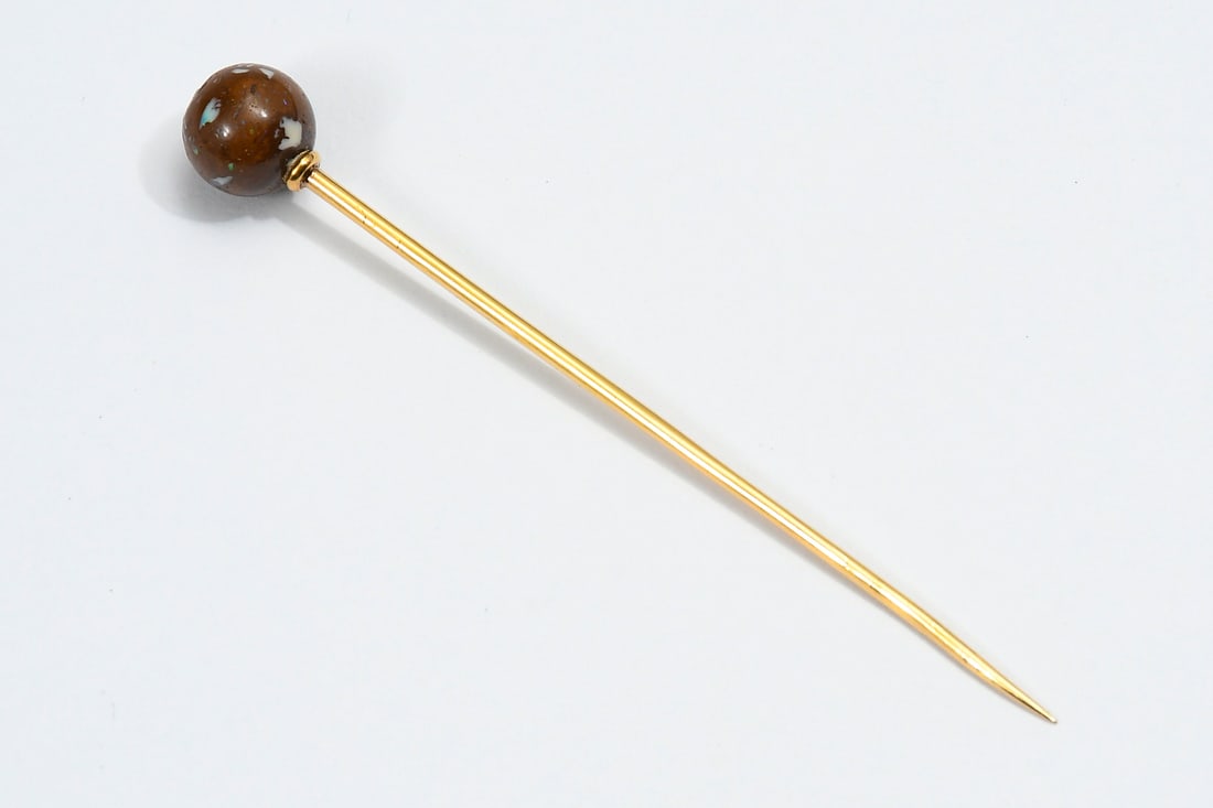 TIFFANY & CO. 14K GOLD & BOULDER OPAL STICK PIN: TIFFANY & CO. 14K GOLD & BOULDER OPAL STICK PIN: 14K yellow gold stick pin with an 8.00 mm boulder opal. The opal is 97% ironstone with some blue/green play-of-color. Pin is signed: Tiffany & Co. Weig