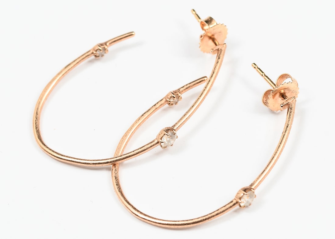 18K GOLD JADE TRAU DIAMOND HOOP EARRINGS: 18K GOLD JADE TRAU DIAMOND HOOP EARRINGS: 18K yellow gold diamond hoop earrings contain 4 round brilliant cut diamonds. WEIGHT: .35 Ct. approx. Rated VS in clarity and E-F in color. The diamonds are p